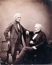 Michael Faraday und William Thomas Brande (sitzend), 1850er bis Mitte 1860er Jahre